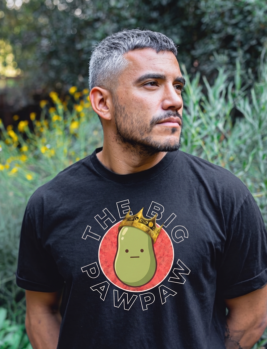 Man wearing a black t-shirt with 'The Big Pawpaw' logo outdoors.